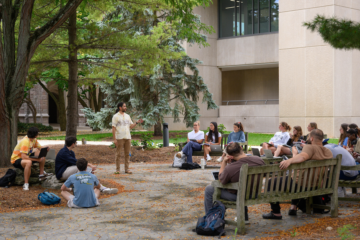 Students attending a lecture outside